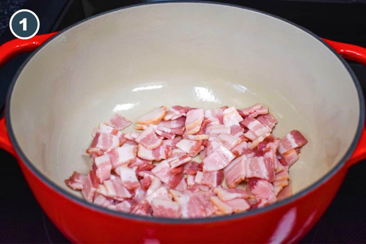 Chopped bacon added to a large pot, before cooking.