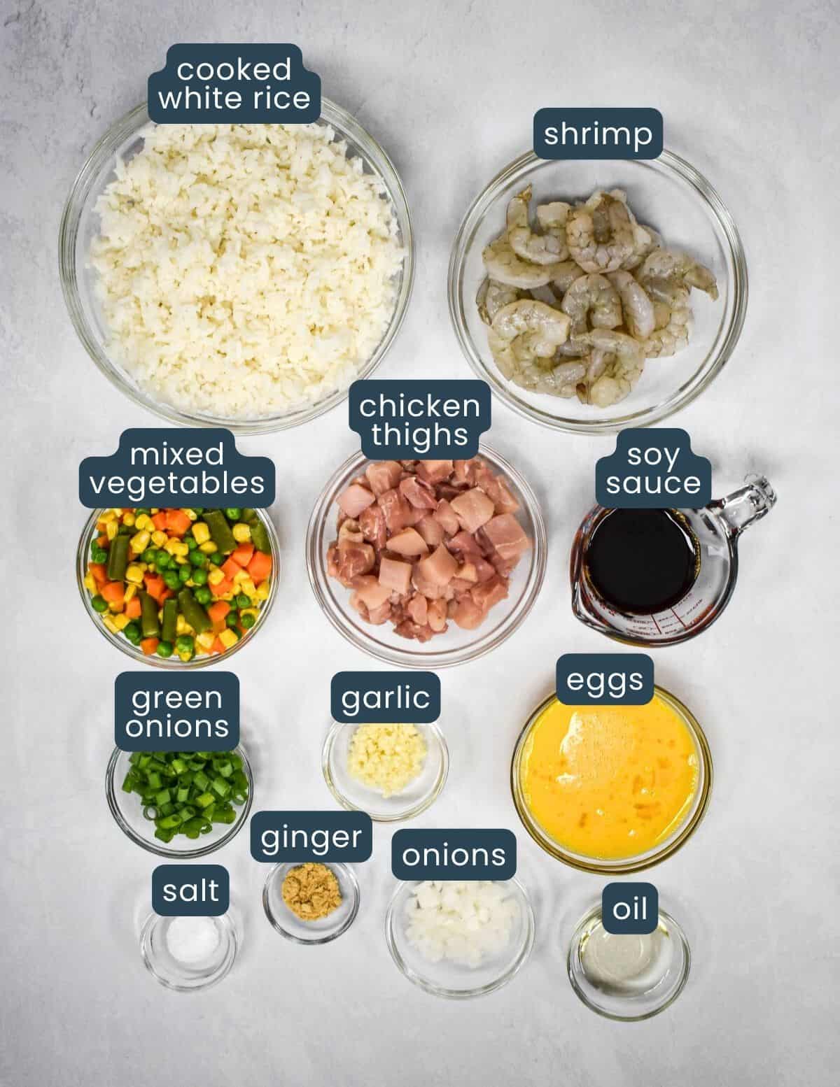 The ingredients for the recipe prepped, arranged in glass bowls, and labeled with the ingredient name.