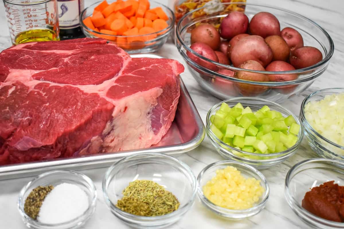 The ingredients for the stovetop pot roast arranged on a table.