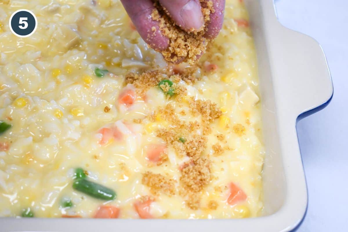 Sprinkling buttered breadcrumbs over the casserole before baking.