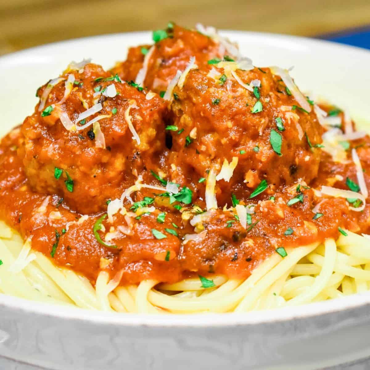 Italian sausage meatballs served over spaghetti.