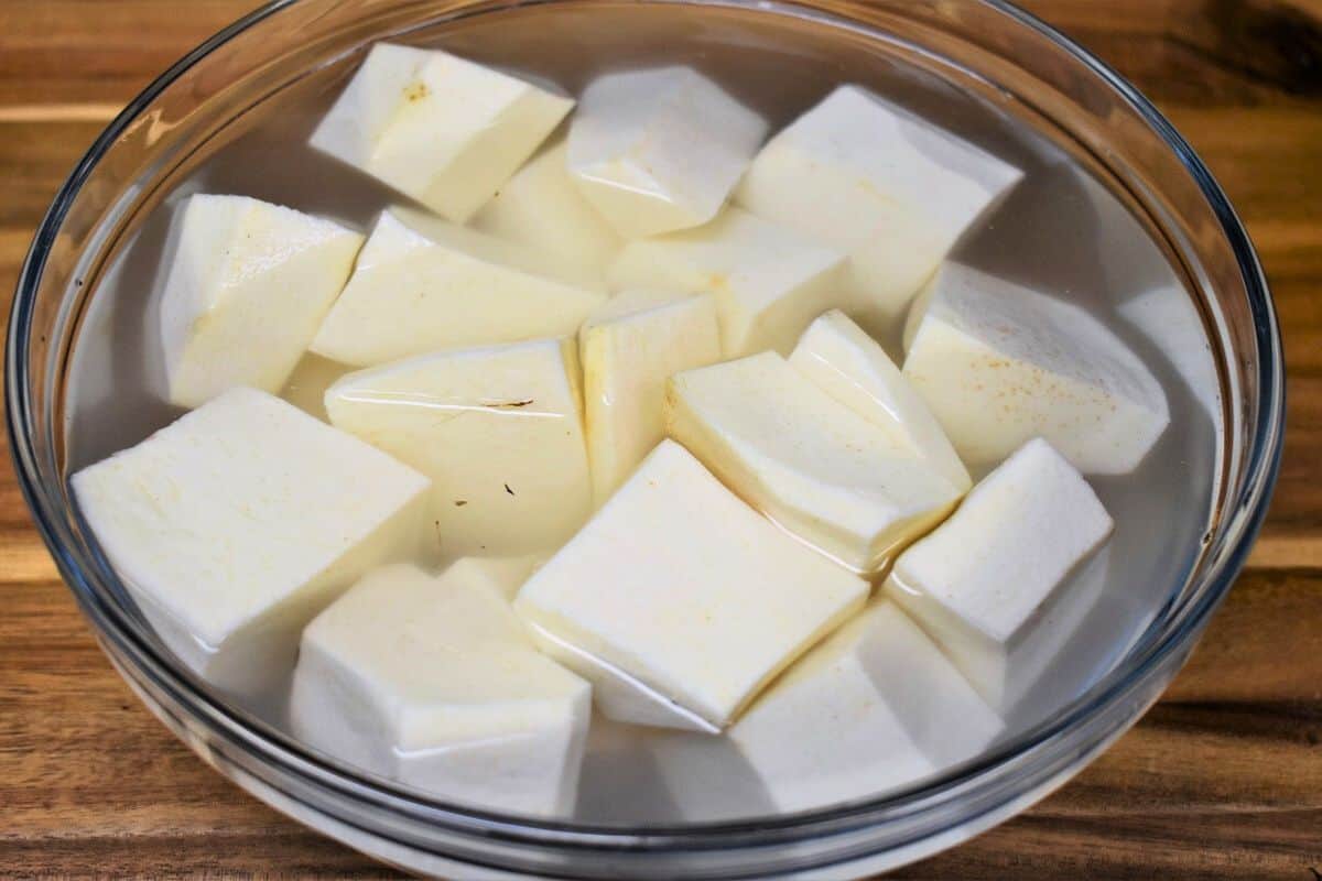 Peeled Cubed Malanga in a bowl covered with water