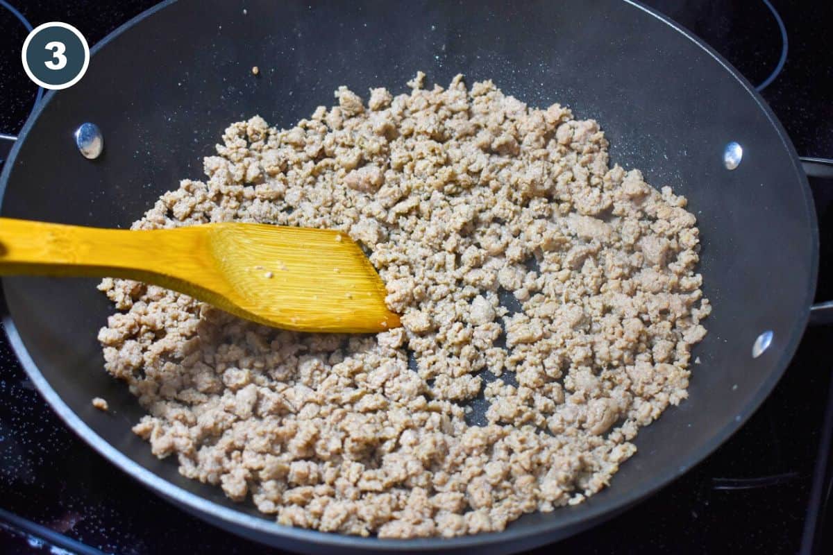 Ground turkey browning in a large non-stick skillet.