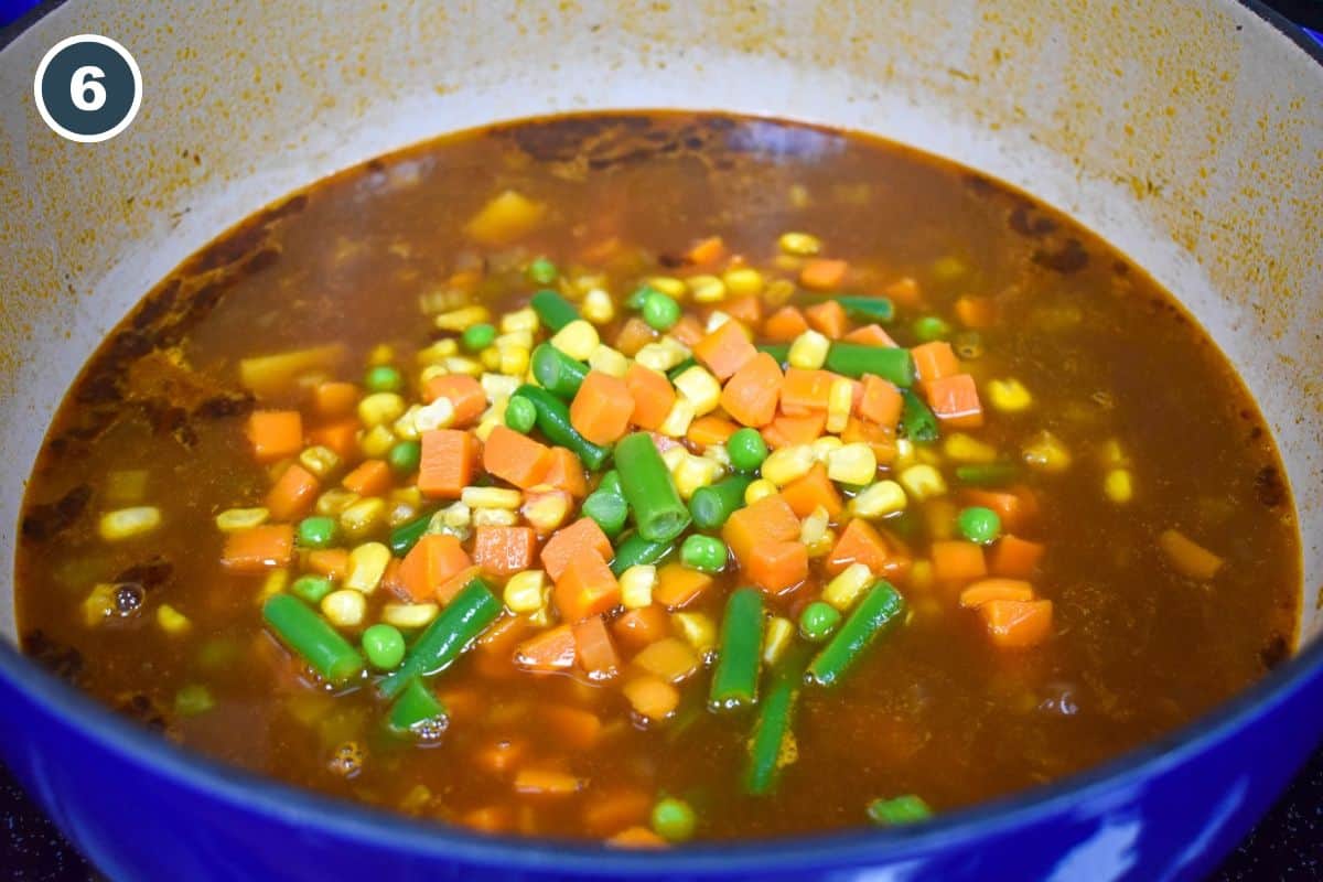 Mixed vegetables added to the soup.