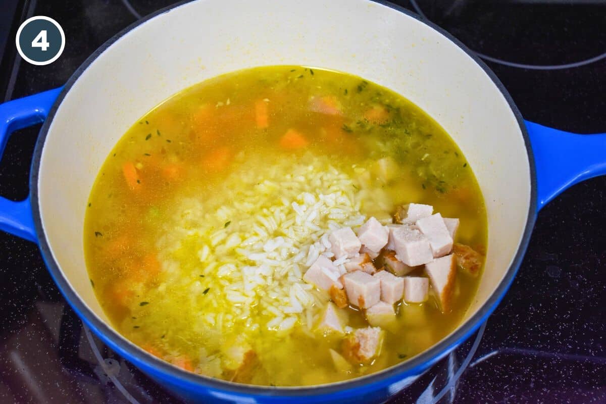 Diced turkey and rice added to the pot with the broth and vegetables.