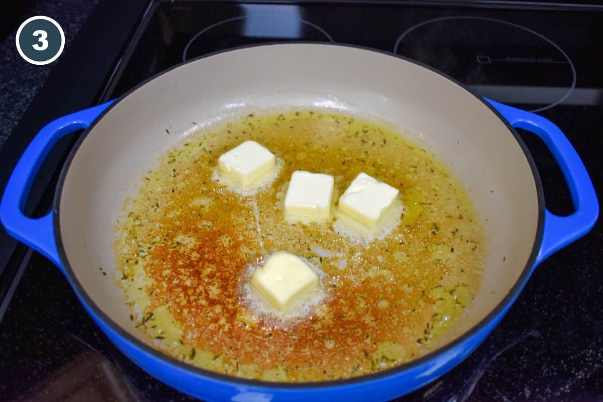 Four pats of butter in the skillet the chicken was cooked in.