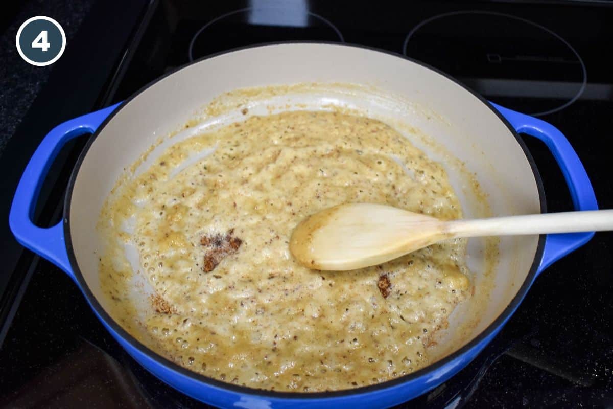 A flour and butter mixture in the drippings created by the chicken and a wooden spoon for stirring.