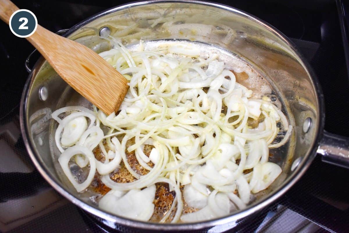 Sliced onion added to the pan where the pork chops were browned.