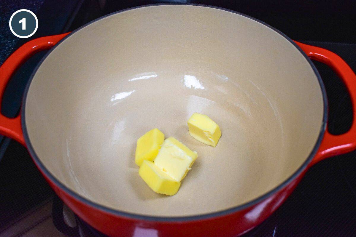 Pats of butter in a red pot.