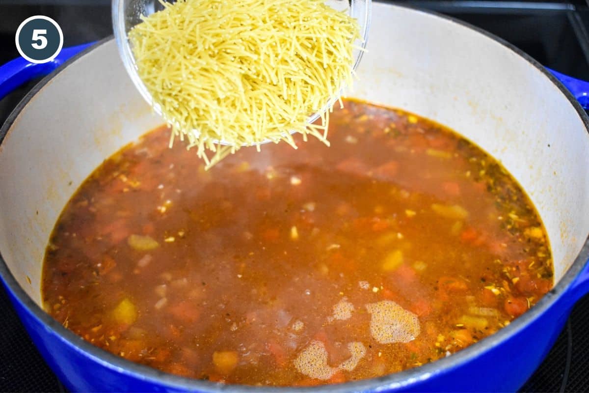 Vermicelli noodles being added to the soup.