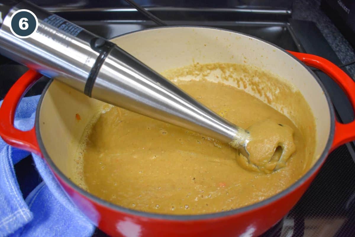 The soup processed in the pot with an immersion blender.