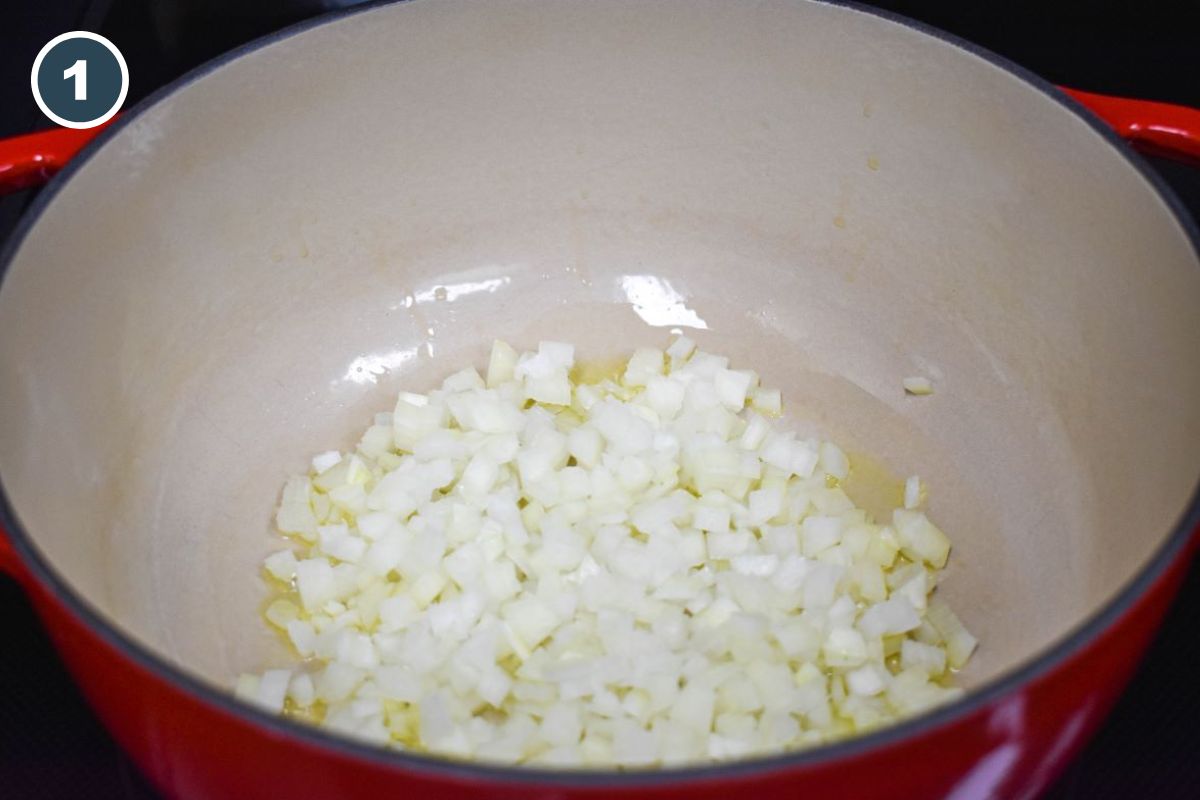 Diced onions sauteing in a pot.