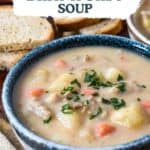 The finished soup served in a blue and white bowl with a graphic and the title on top.