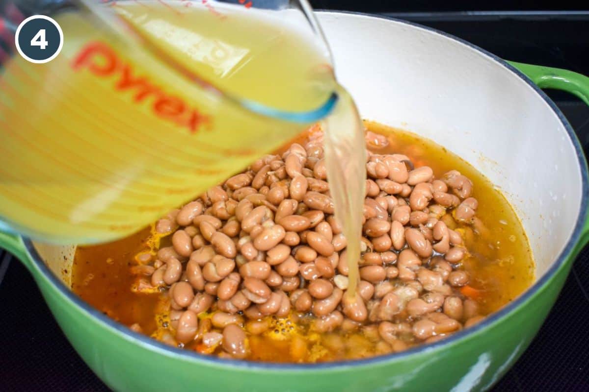 Pinto beans and chicken broth being added to the pot.